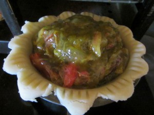While the cookies baked, Isane turned the rhubarb that the little girls gathered into pie filling.  She likes to thicken and precook the filling before the pie goes into the oven.