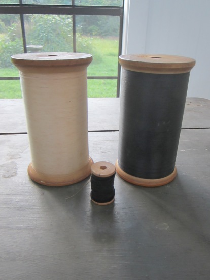 BIGGEST spools of thread in the world :) OK, probably not, but still huge. The smaller spool is normal size.