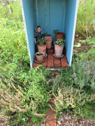 Izzybelle's sisters are all strongly suggesting that she confines her tomato gardening to pots in the greenhouse next year...